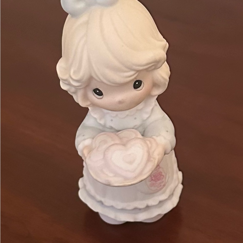 Precious Moments figurine titled "You're the Sweetest Cookie in the Batch".
